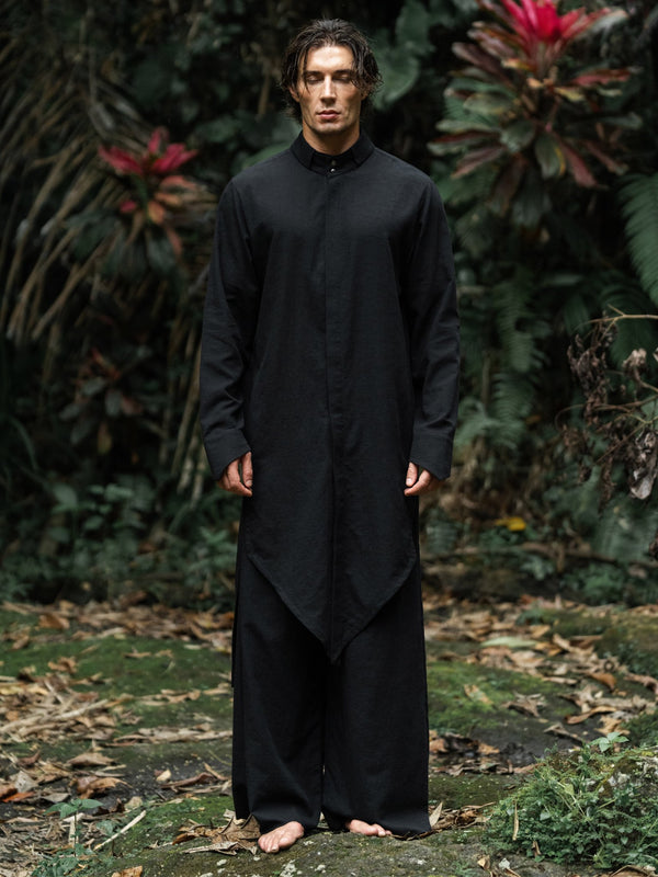 Shop the elegant long shirt made of 100% cotton. Featuring a stylish asymmetrical design, sealed cuffs, and a stand-up collar, this shirt combines modern style with comfort. Perfect for both casual and formal looks.