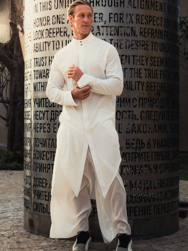 Shop the elegant long shirt made of 100% cotton. Featuring a stylish asymmetrical design, sealed cuffs, and a stand-up collar, this shirt combines modern style with comfort. Perfect for both casual and formal looks.