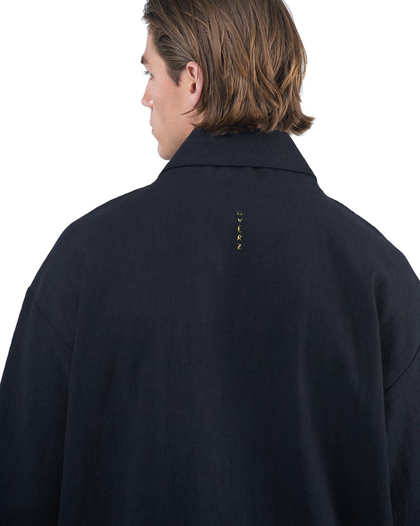 Black kimono-style blazer with accent collar and wooden buttons by OVERZ