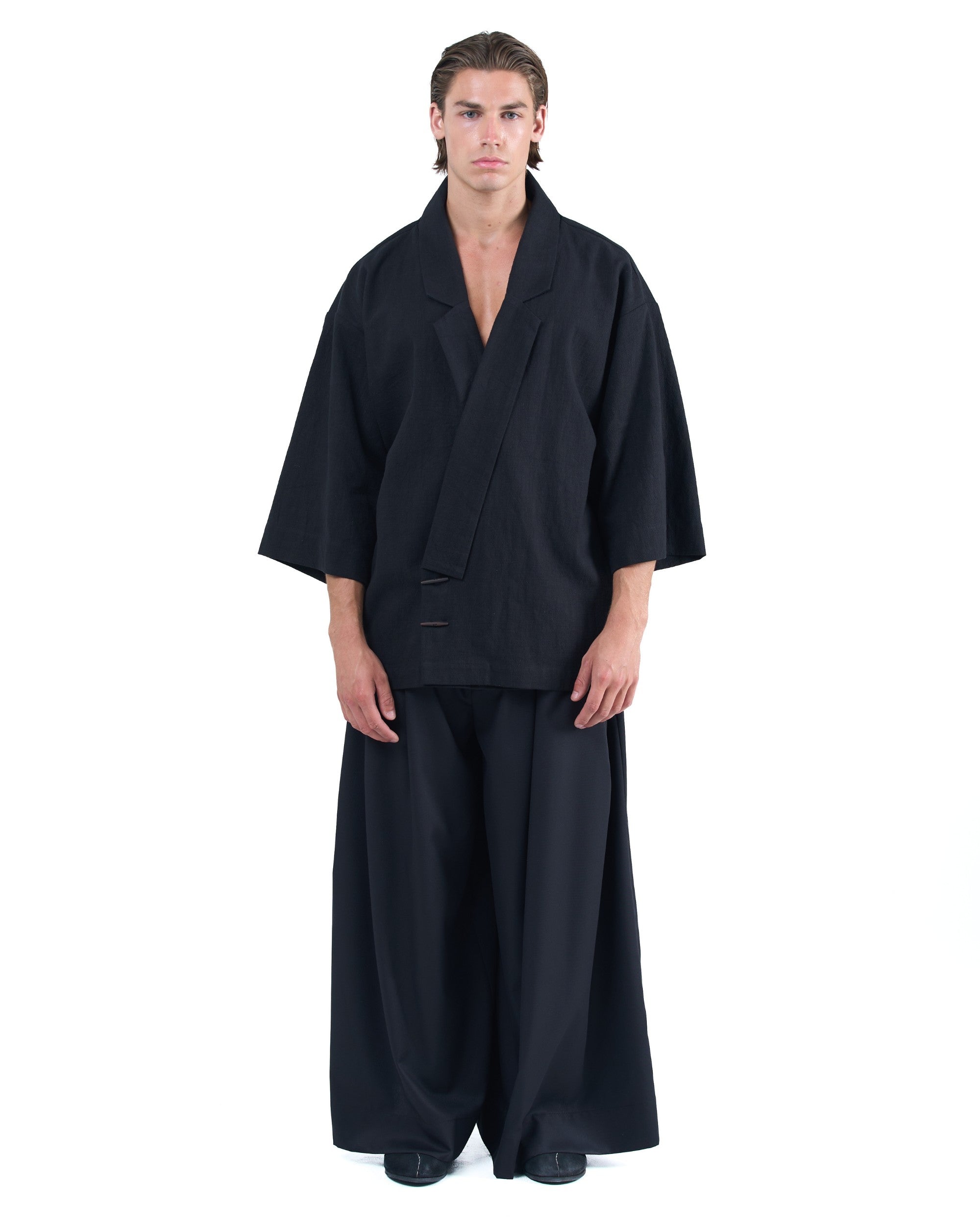 Black kimono-style blazer with accent collar and wooden buttons by OVERZ