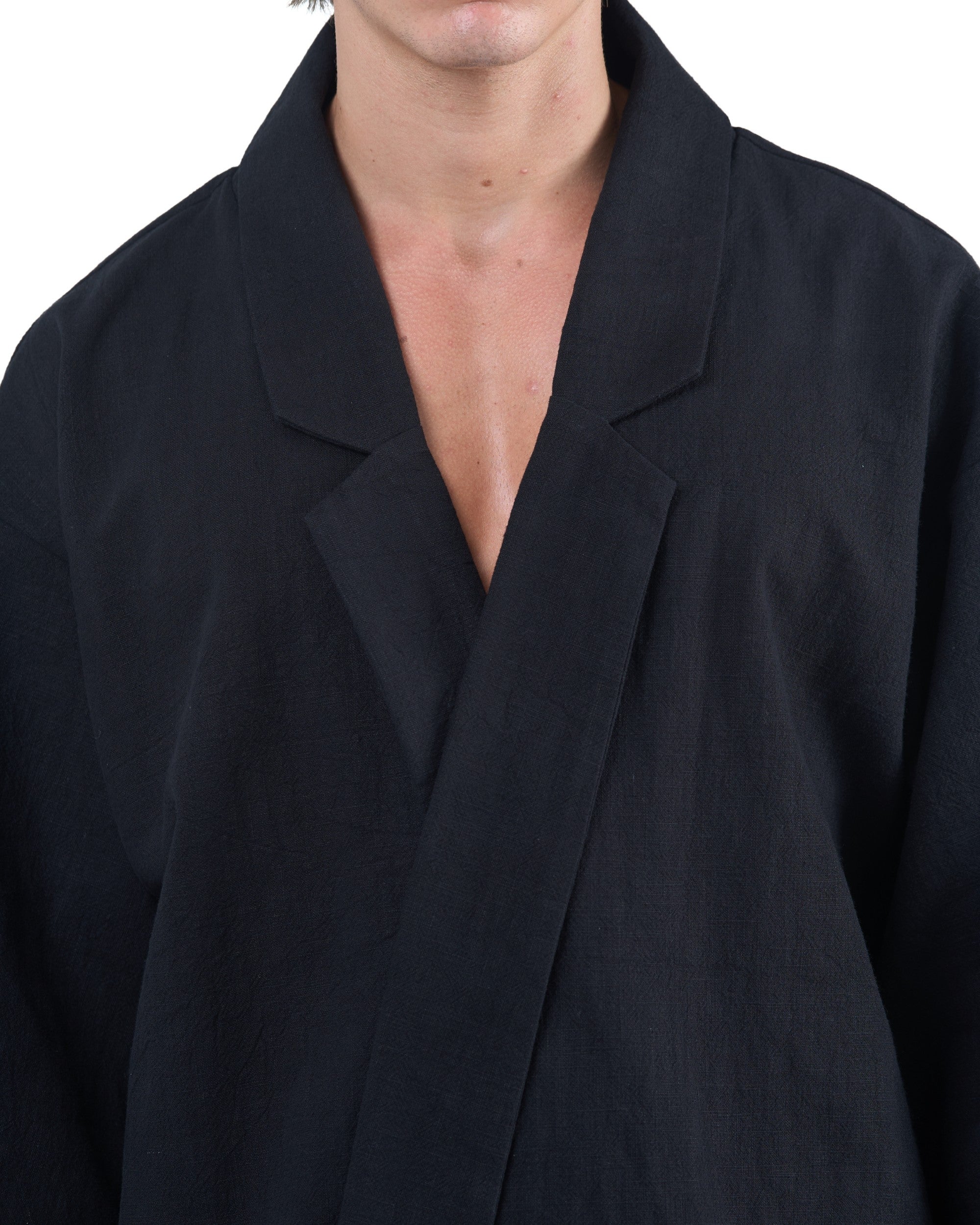 Black kimono-style blazer with accent collar and wooden buttons by OVERZ