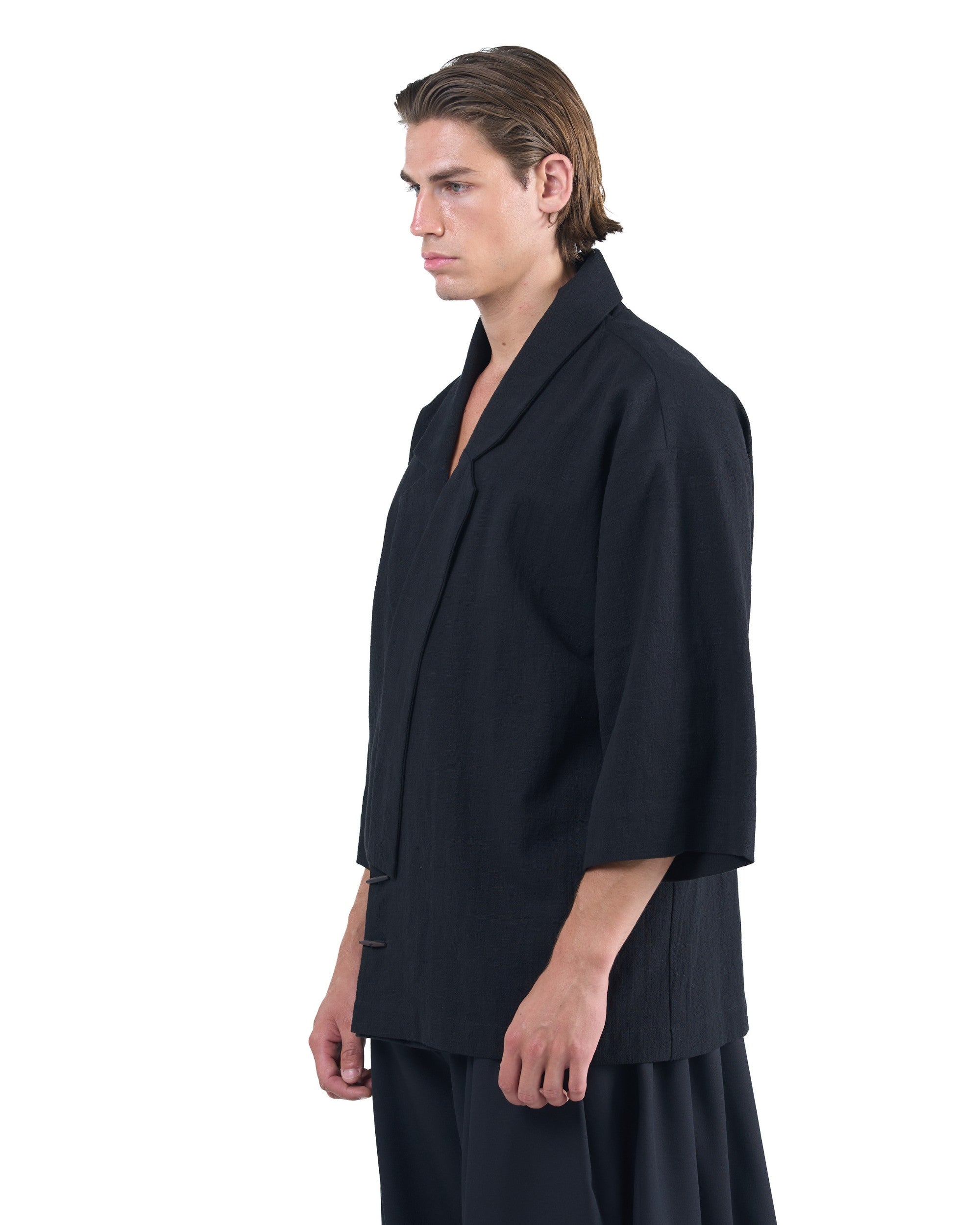 Black kimono-style blazer with accent collar and wooden buttons by OVERZ