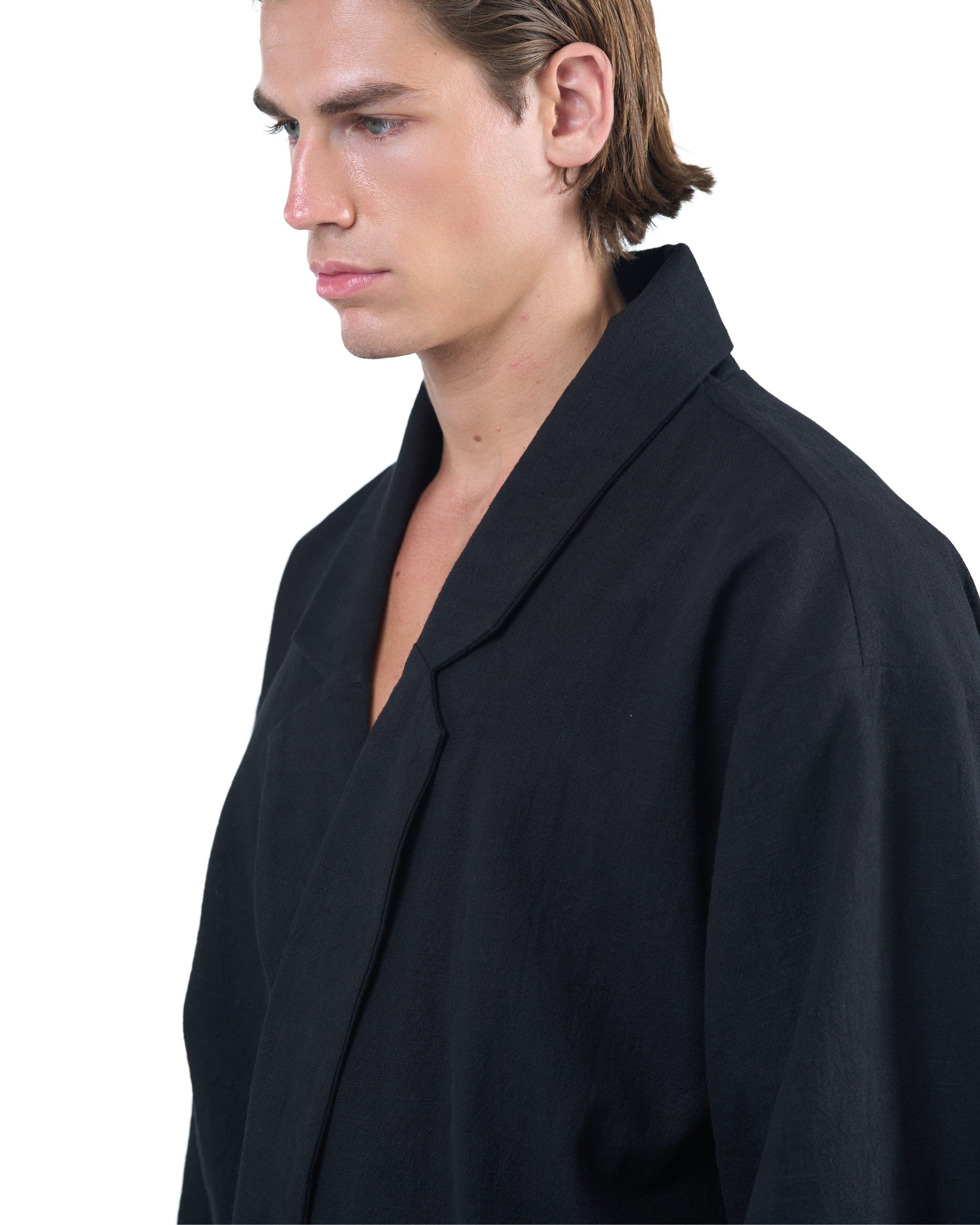 Black kimono-style blazer with accent collar and wooden buttons by OVERZ
