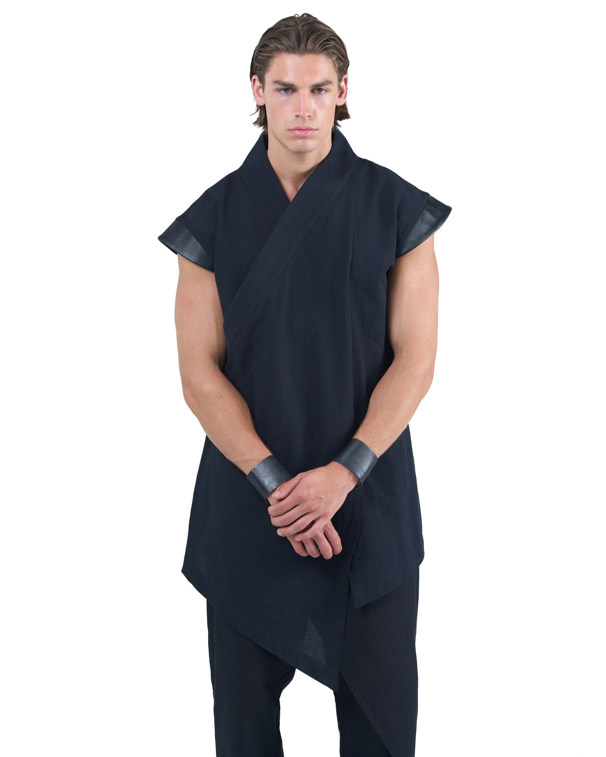 Black asymmetric kimono-style shirt with leather shoulders and wrap front by OVERZ worn by male model