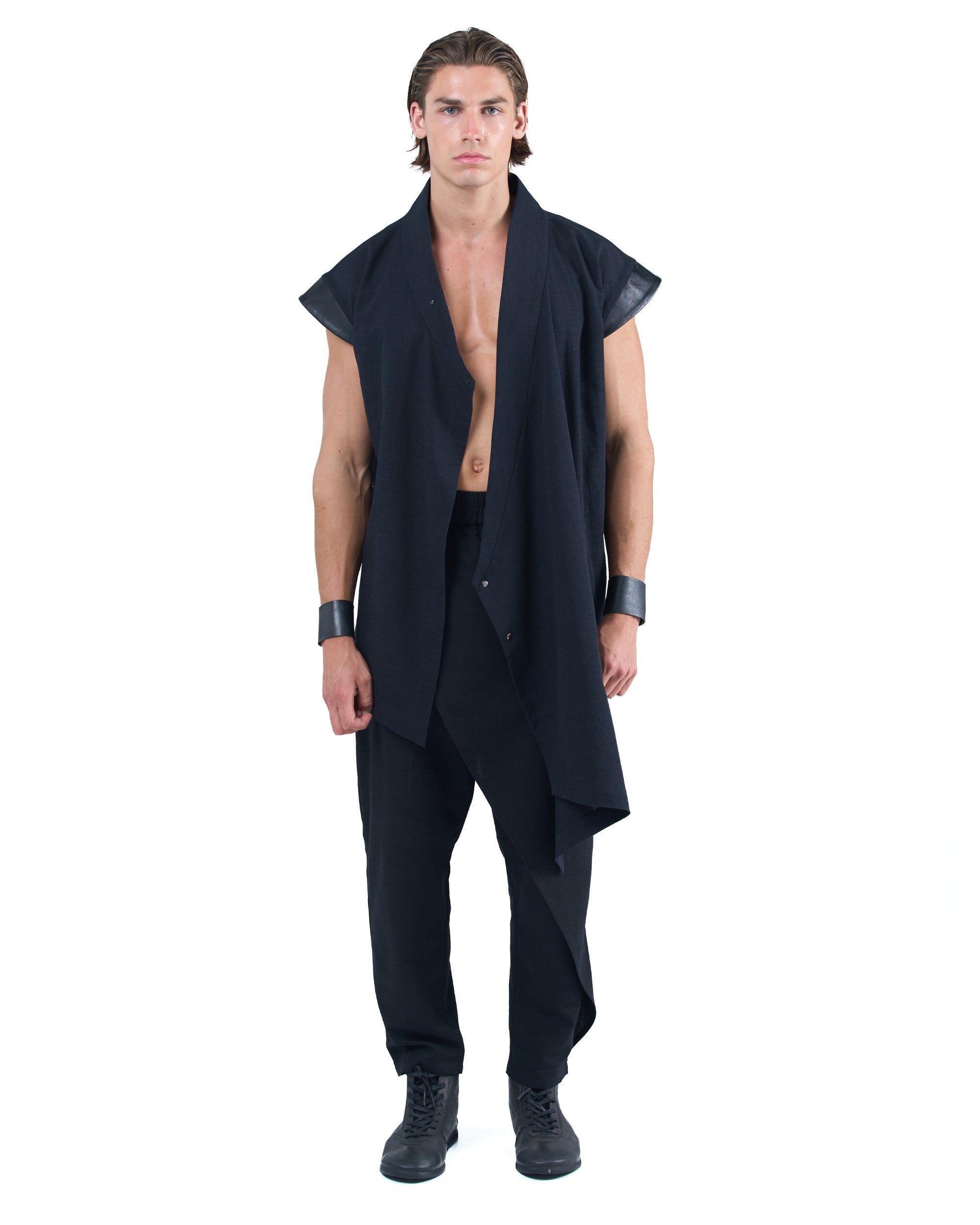 Black asymmetric kimono-style shirt with leather shoulders and wrap front by OVERZ worn by male model