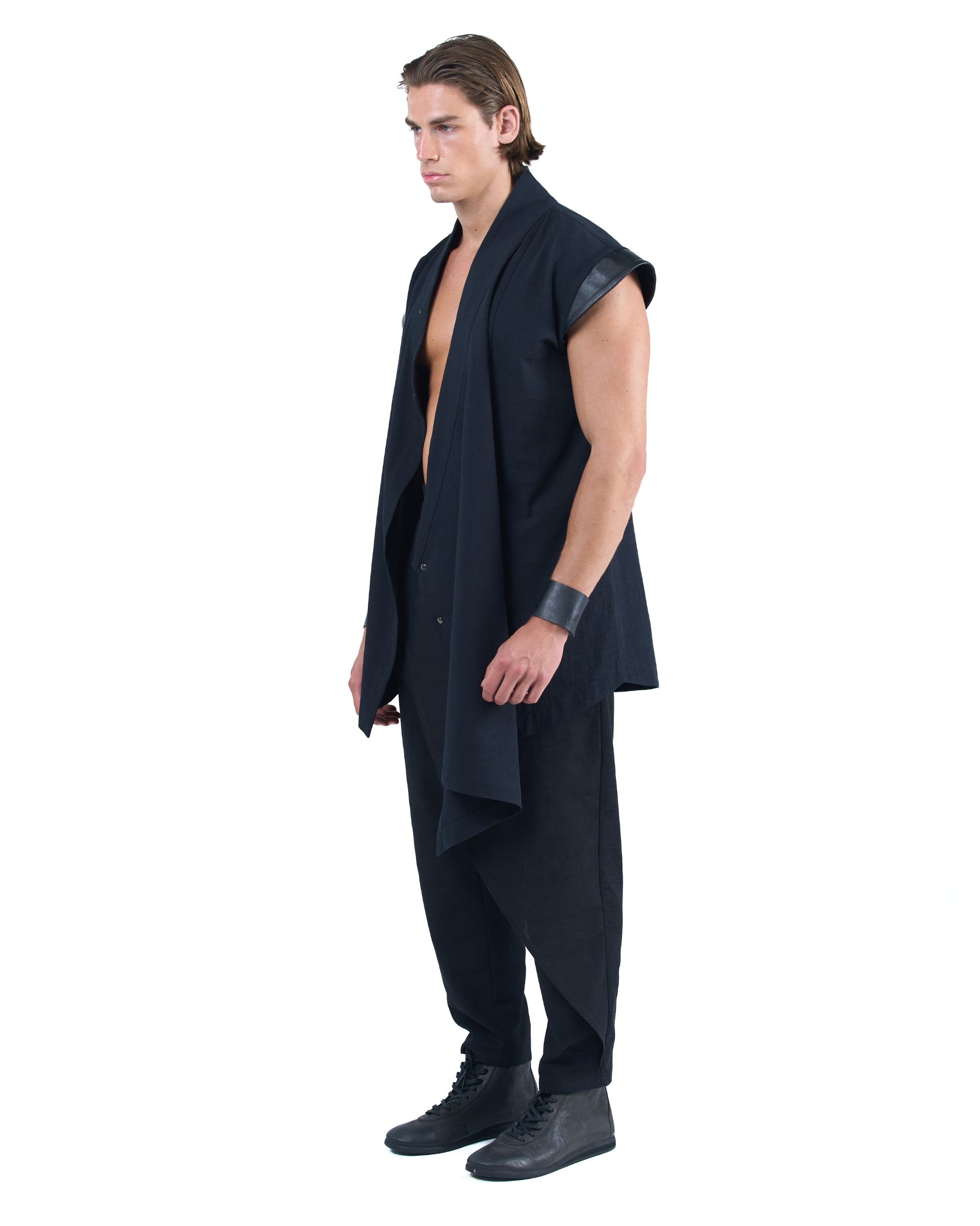 Black asymmetric kimono-style shirt with leather shoulders and wrap front by OVERZ worn by male model