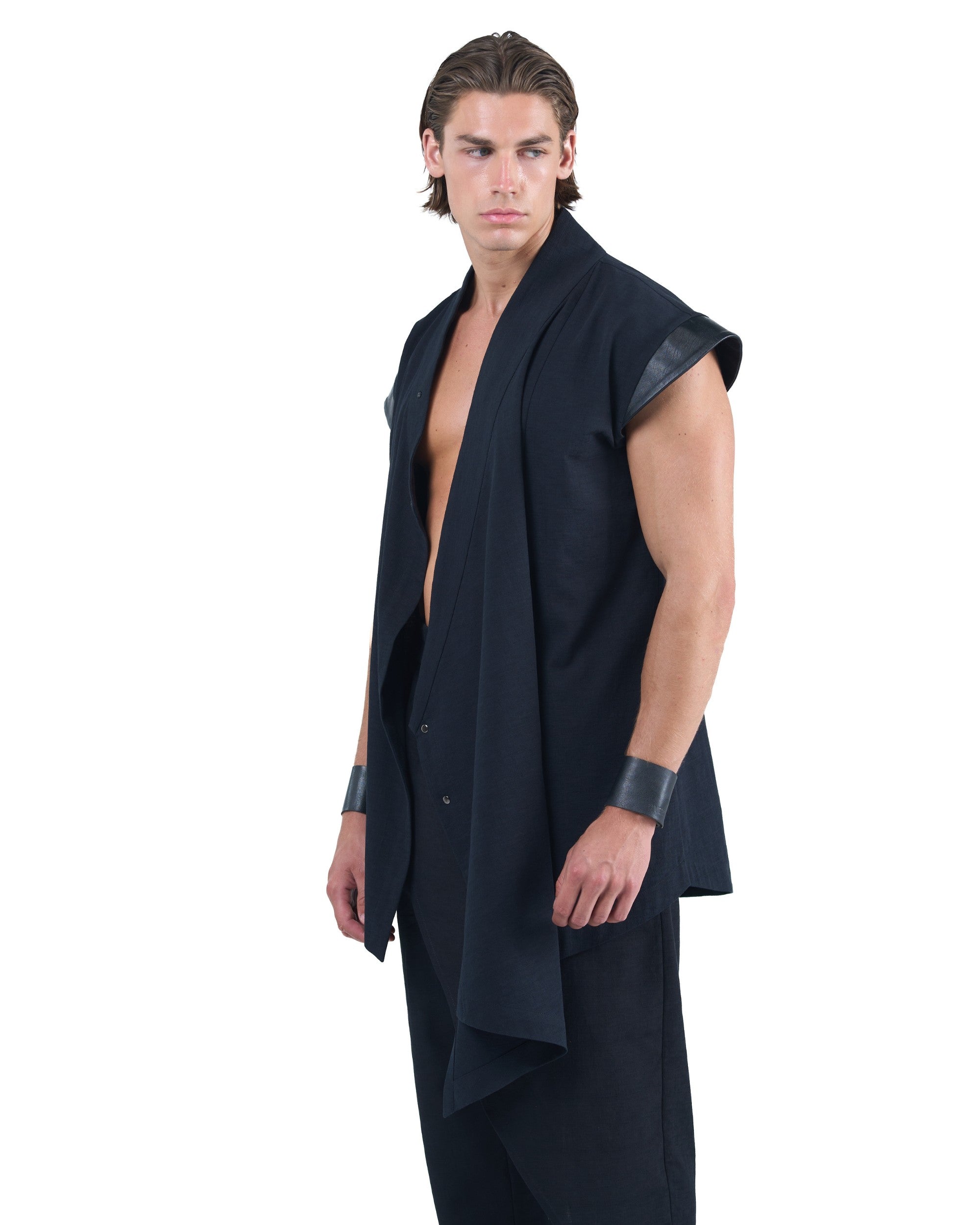 Black asymmetric kimono-style shirt with leather shoulders and wrap front by OVERZ worn by male model