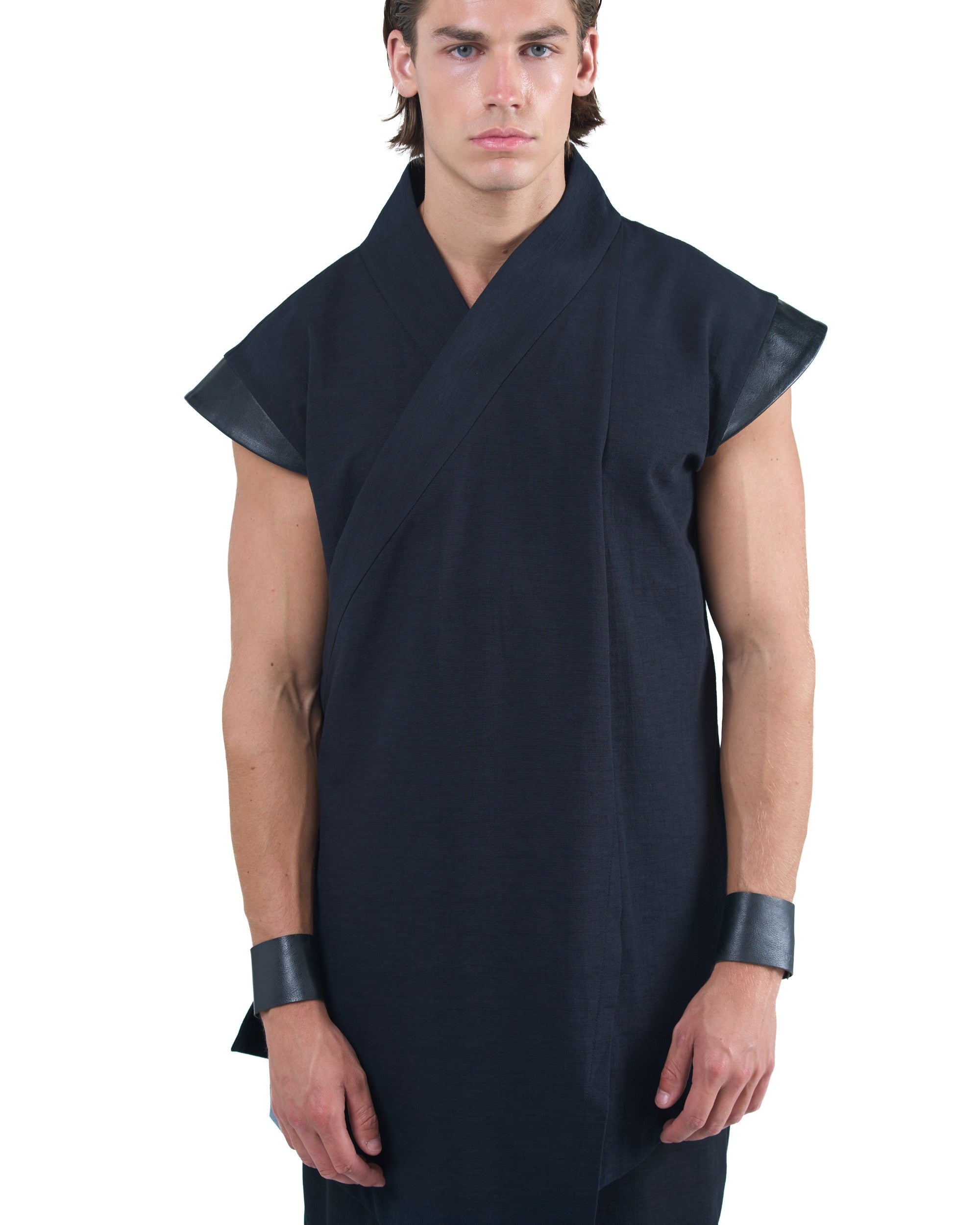 Black asymmetric kimono-style shirt with leather shoulders and wrap front by OVERZ worn by male model