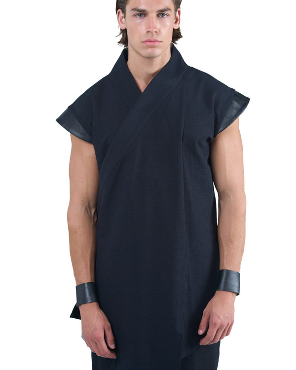 Black asymmetric kimono-style shirt with leather shoulders and wrap front by OVERZ worn by male model