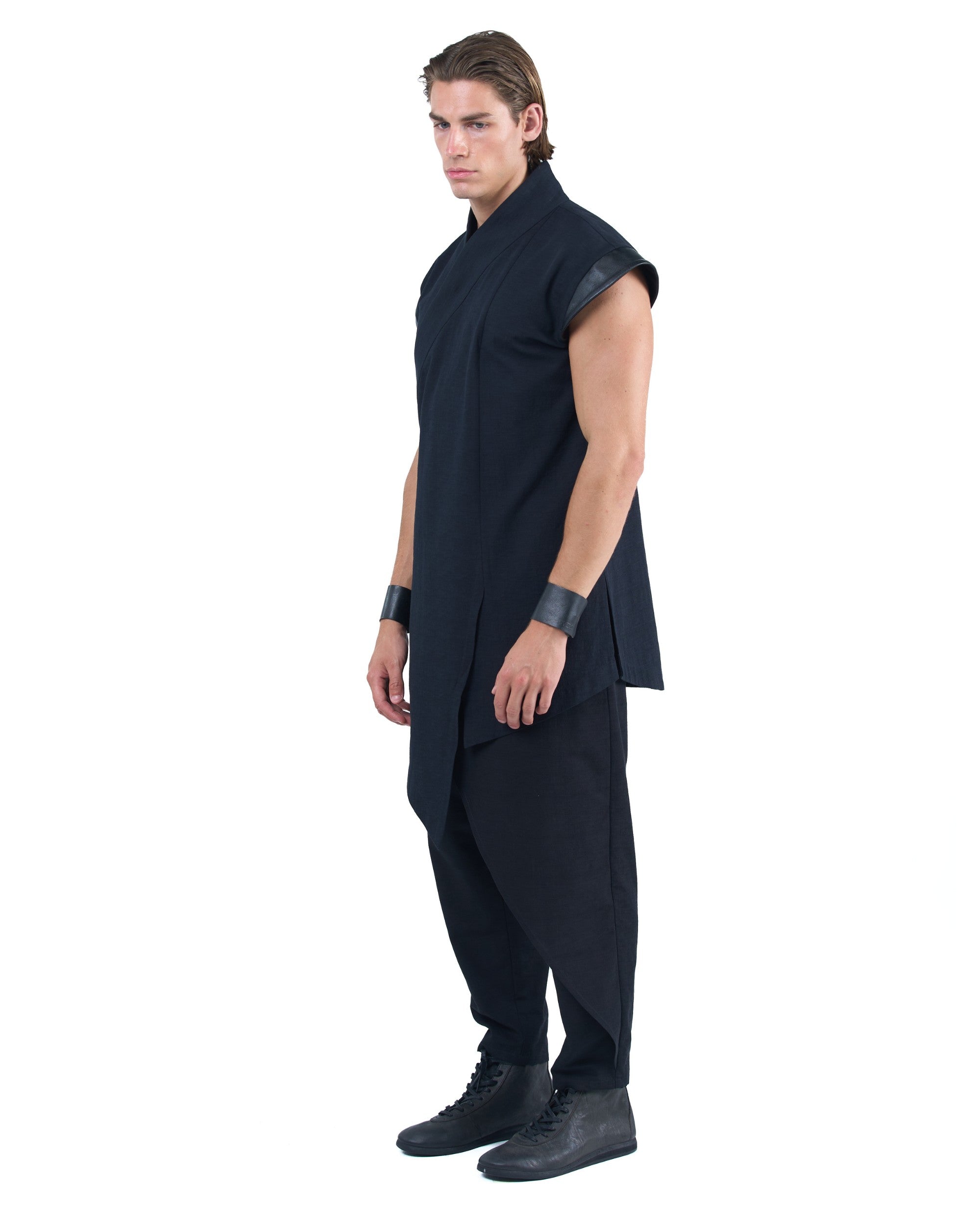 Black asymmetric kimono-style shirt with leather shoulders and wrap front by OVERZ worn by male model