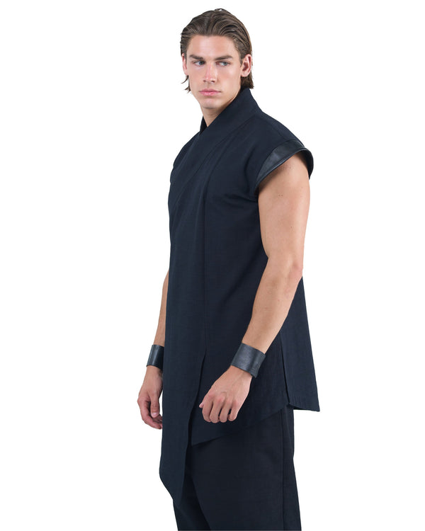 Black asymmetric kimono-style shirt with leather shoulders and wrap front by OVERZ worn by male model