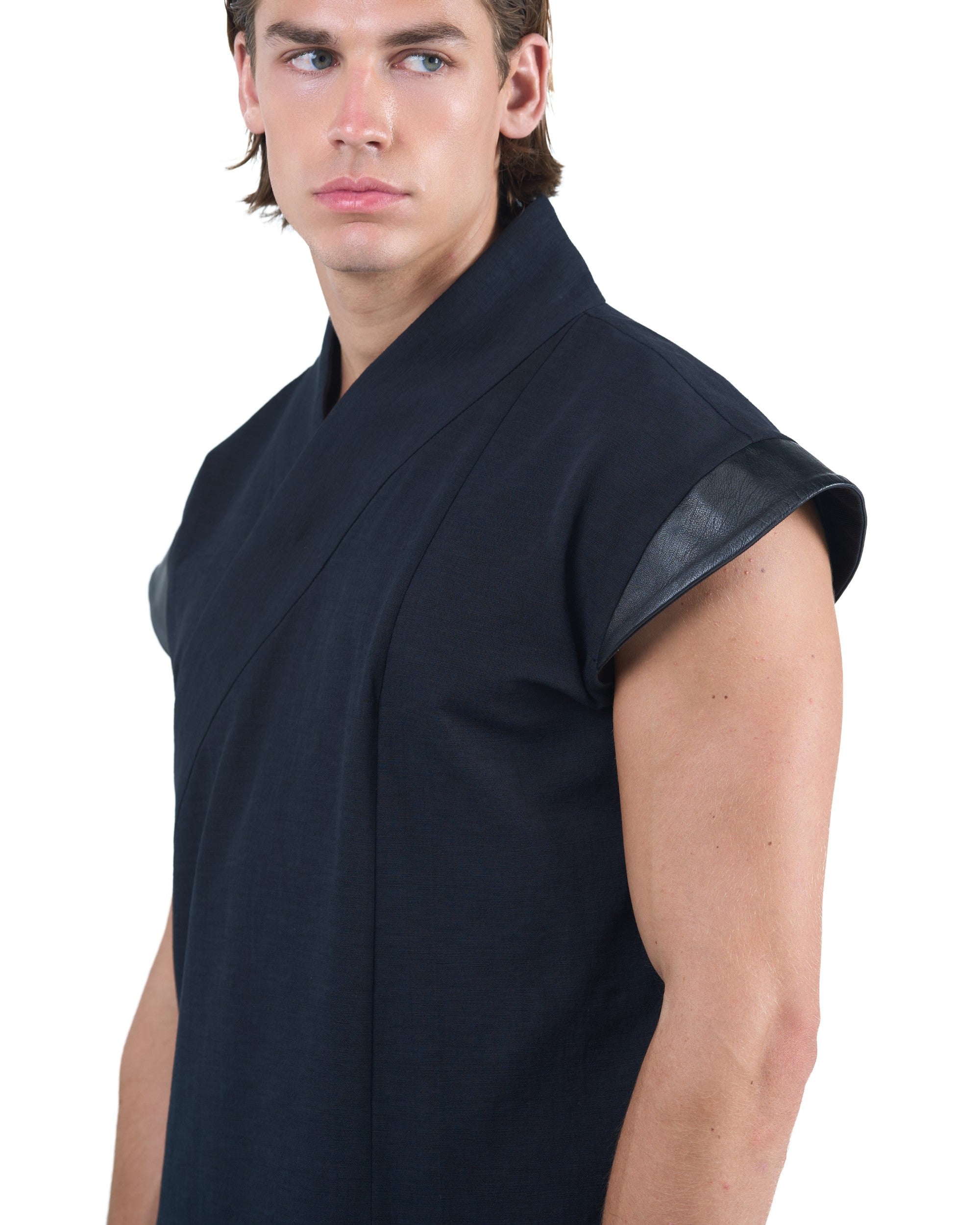 Black asymmetric kimono-style shirt with leather shoulders and wrap front by OVERZ worn by male model