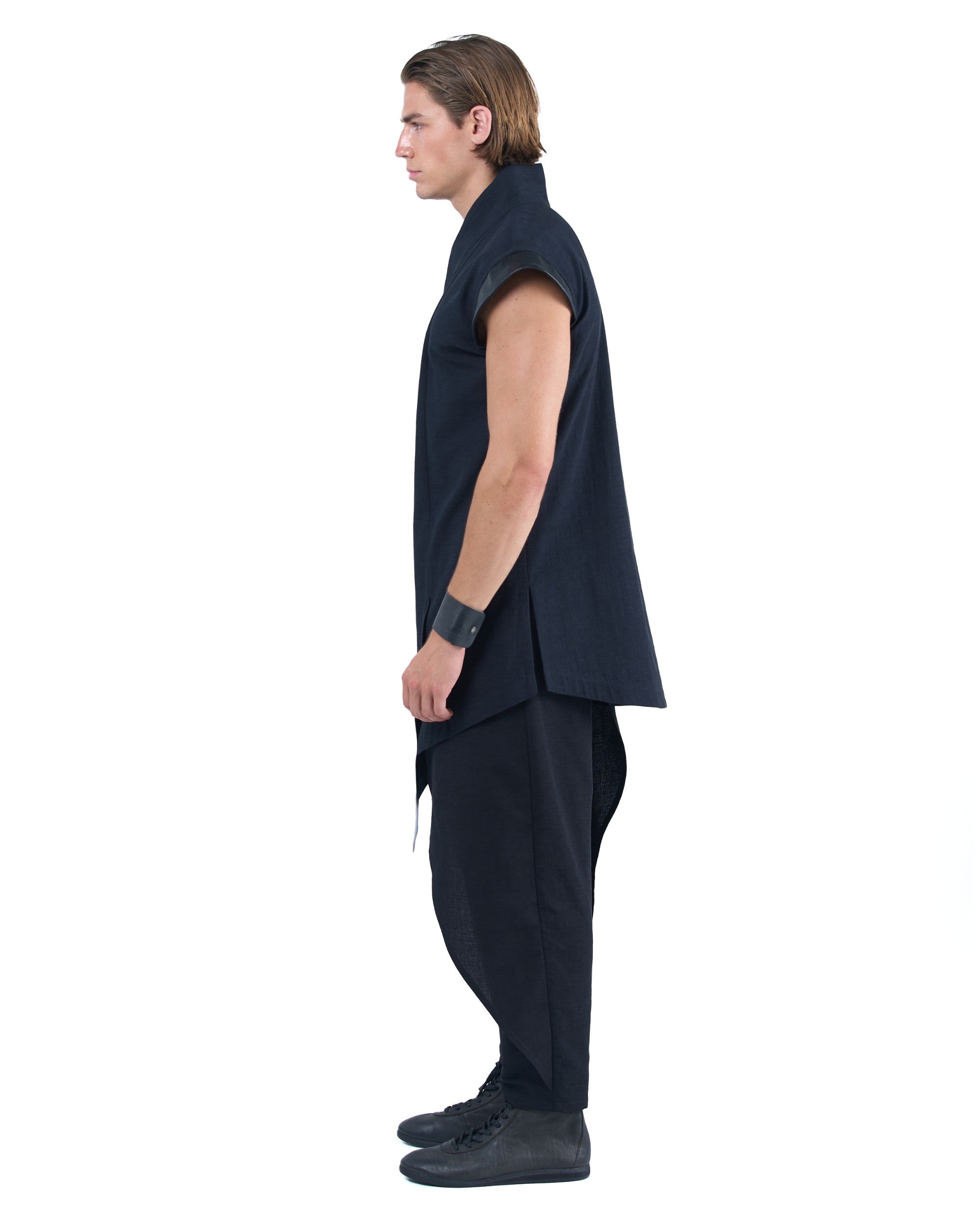 Black asymmetric kimono-style shirt with leather shoulders and wrap front by OVERZ worn by male model