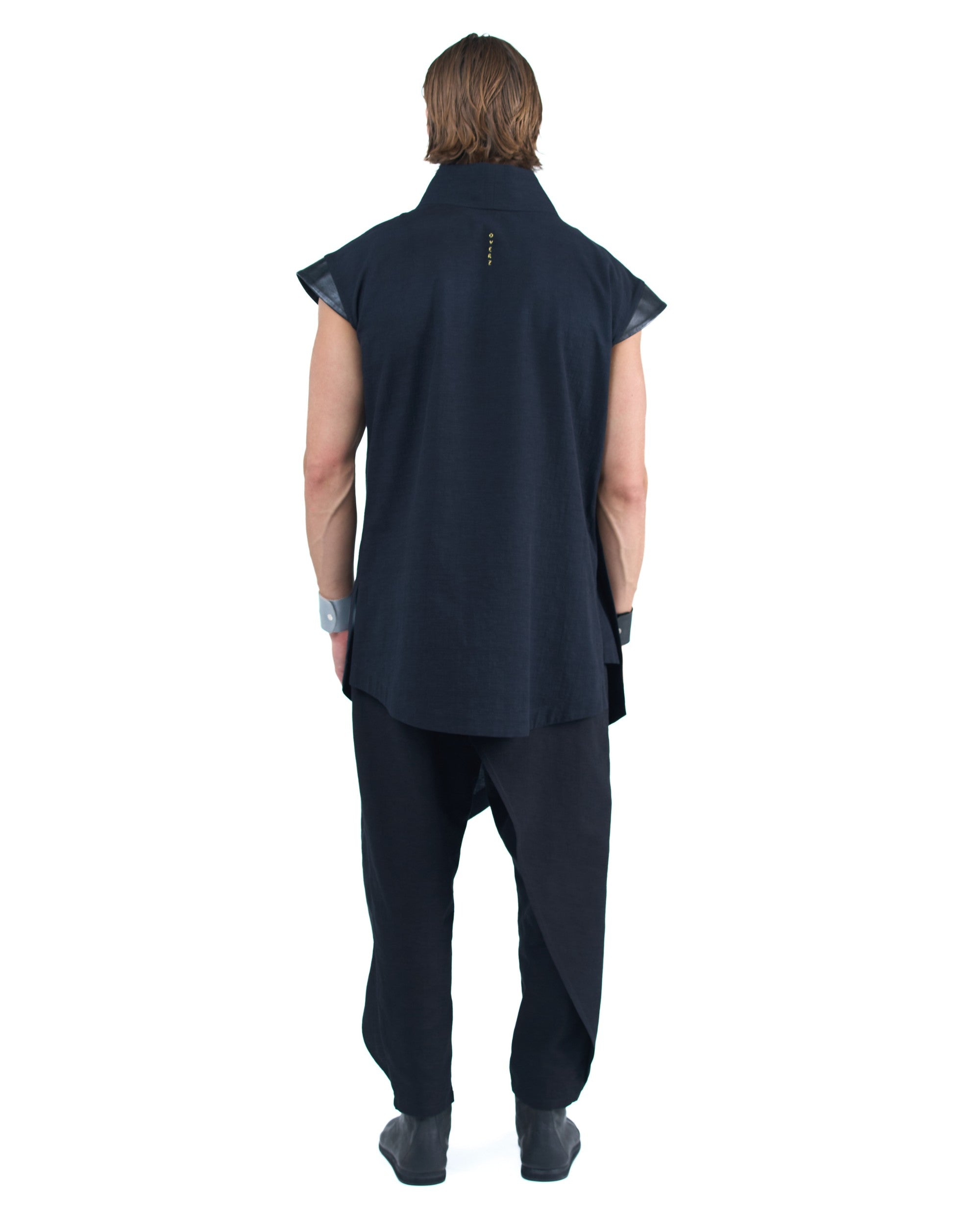 Black asymmetric kimono-style shirt with leather shoulders and wrap front by OVERZ worn by male model