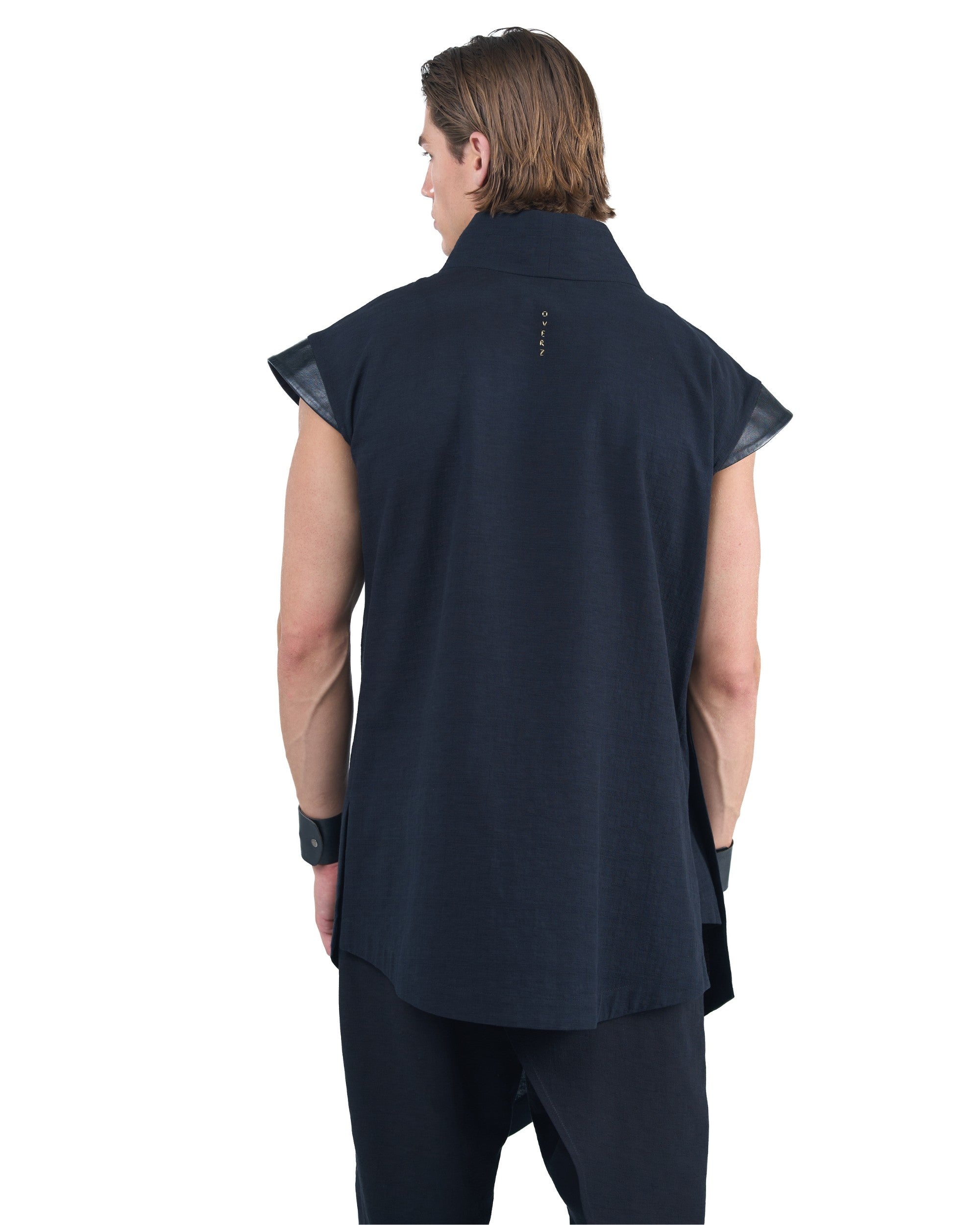 Black asymmetric kimono-style shirt with leather shoulders and wrap front by OVERZ worn by male model
