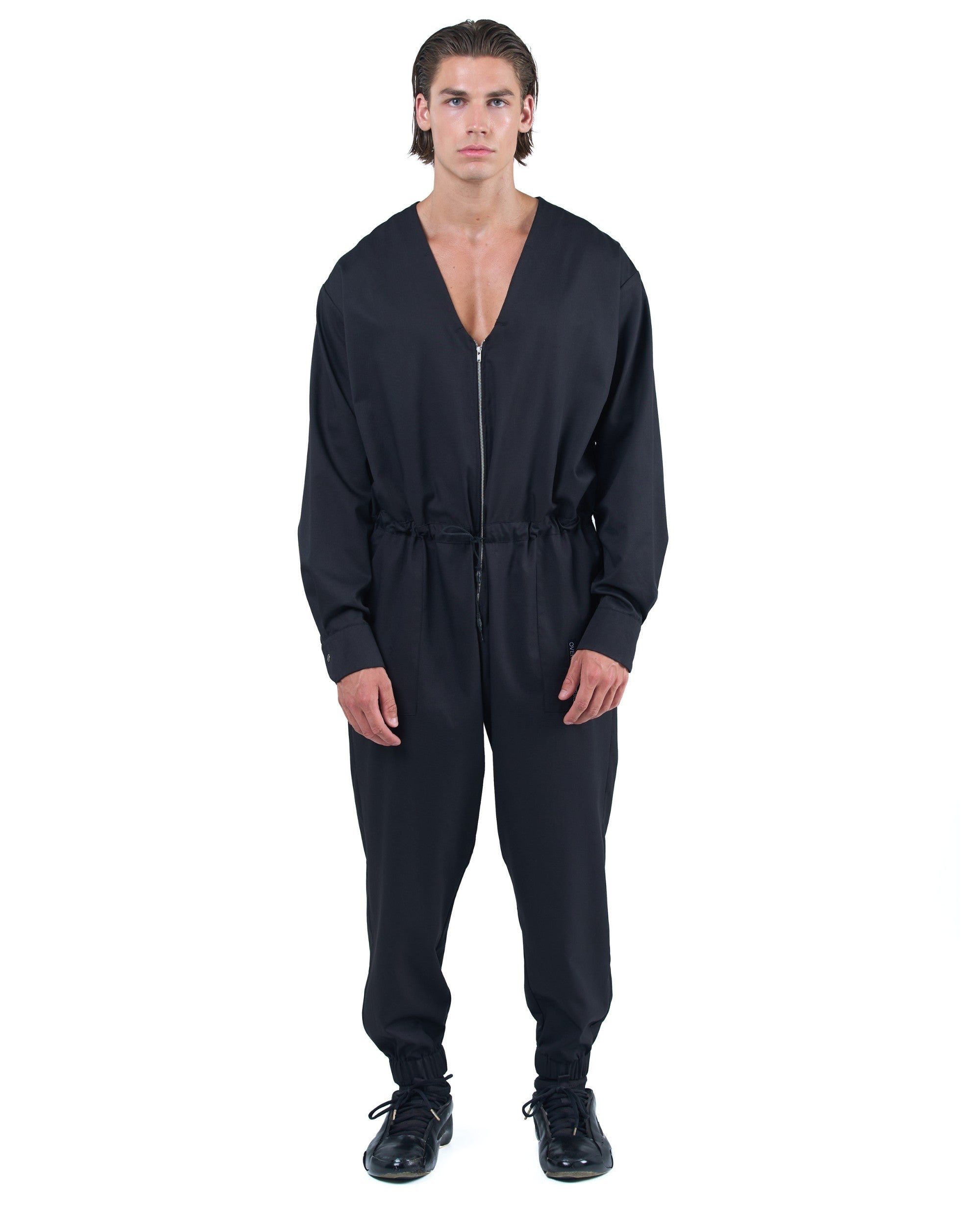 Black men's jumpsuit with zip closure, rope-adjusted waist and elastic cuffs by OVERZ