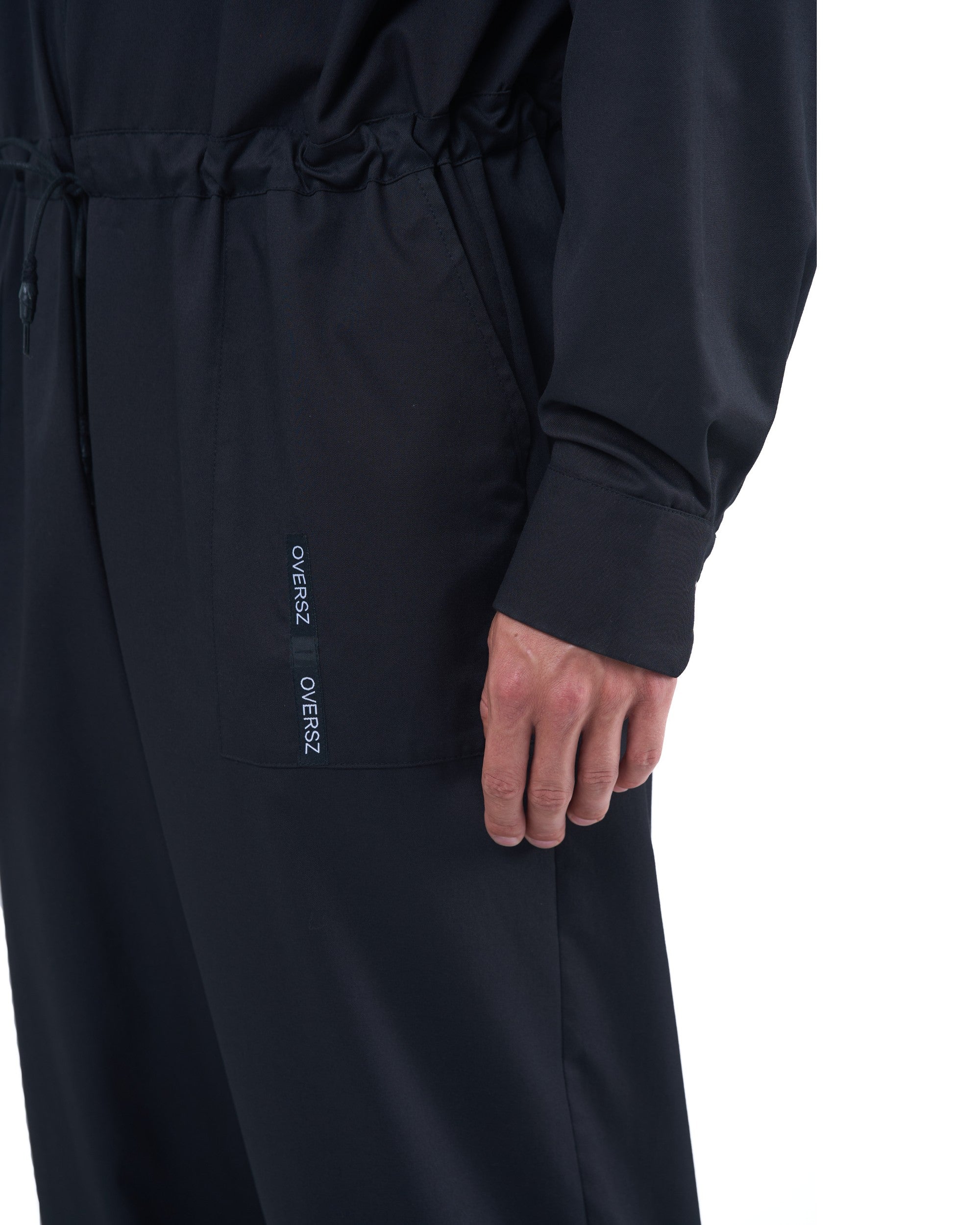 Black men's jumpsuit with zip closure, rope-adjusted waist and elastic cuffs by OVERZ