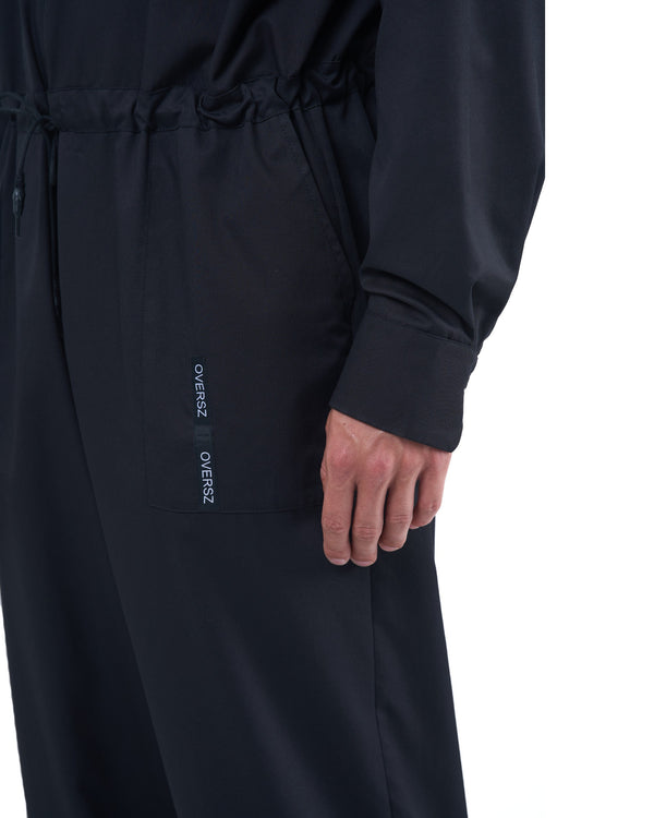 Black men's jumpsuit with zip closure, rope-adjusted waist and elastic cuffs by OVERZ