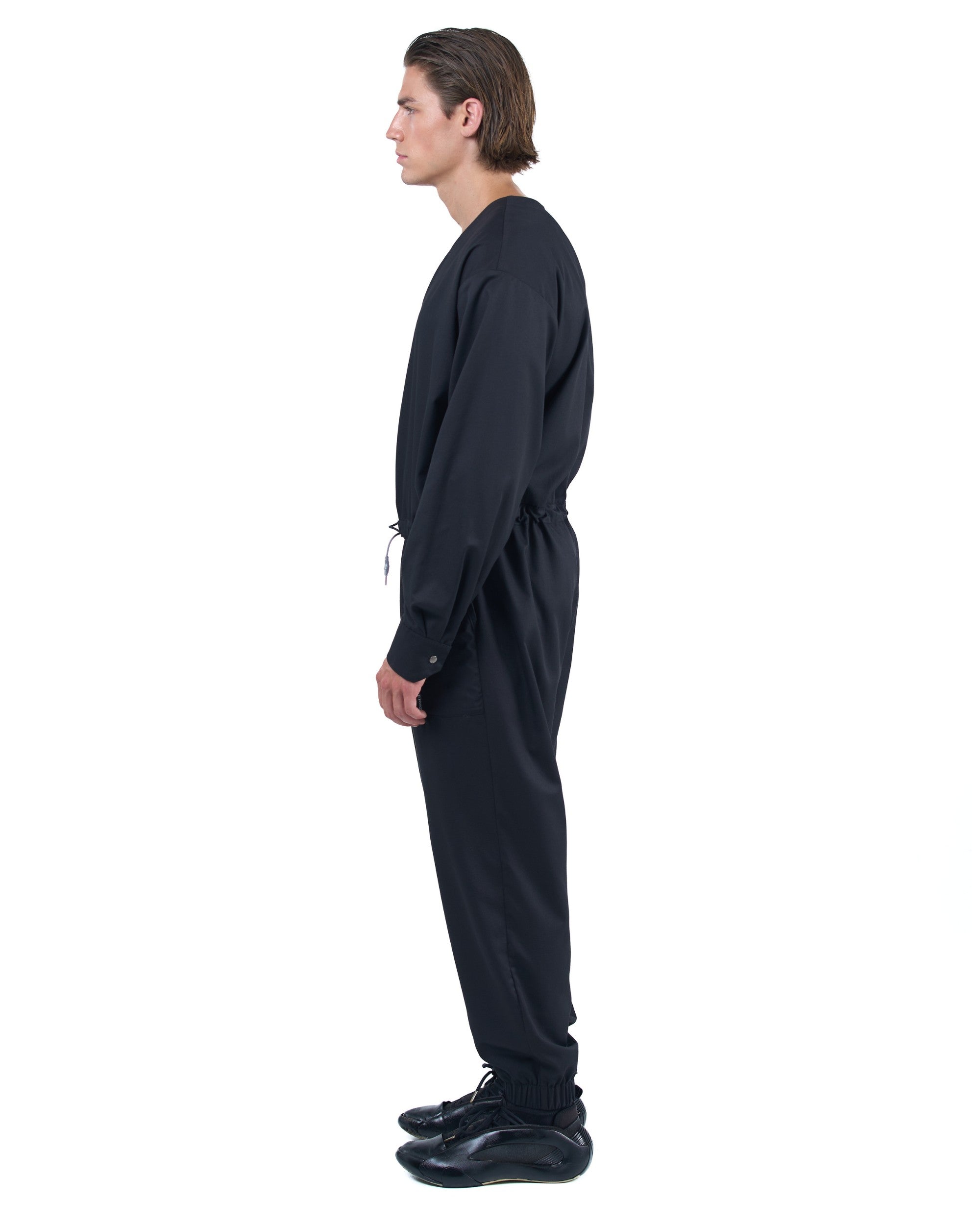 Black men's jumpsuit with zip closure, rope-adjusted waist and elastic cuffs by OVERZ