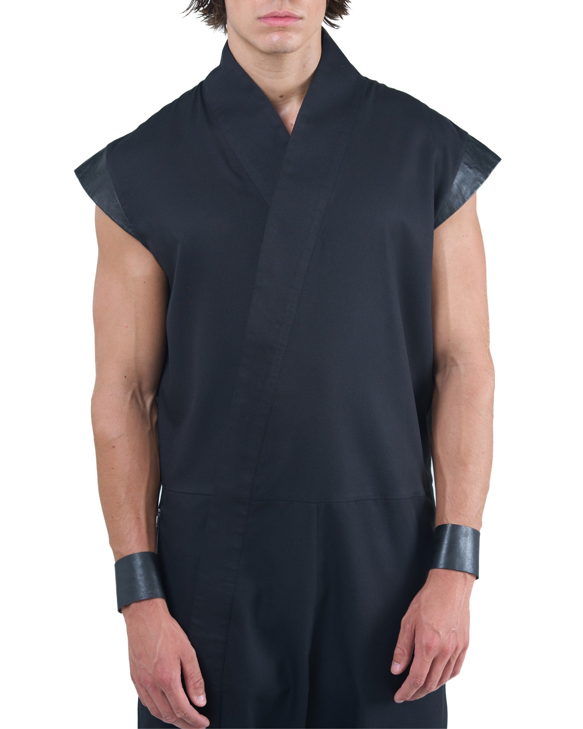 Black asymmetric jumpsuit with leather shoulders and diagonal zip closure by OVERZ
