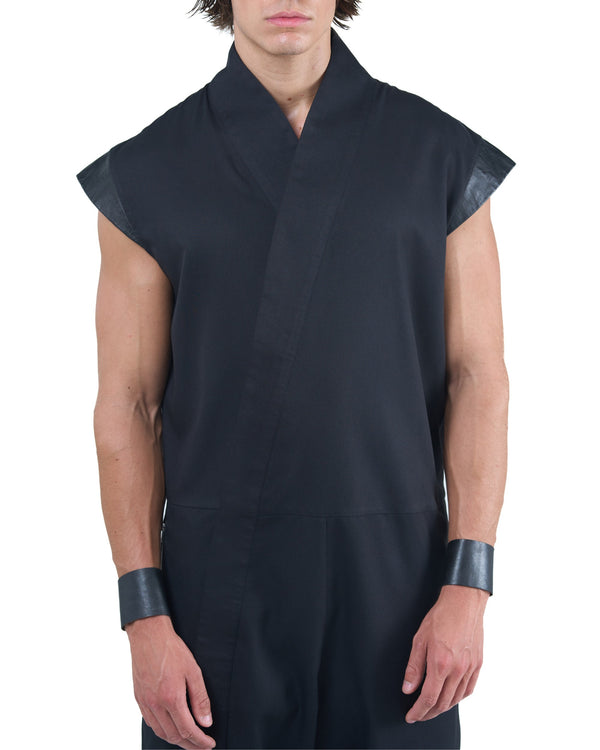 Black asymmetric jumpsuit with leather shoulders and diagonal zip closure by OVERZ