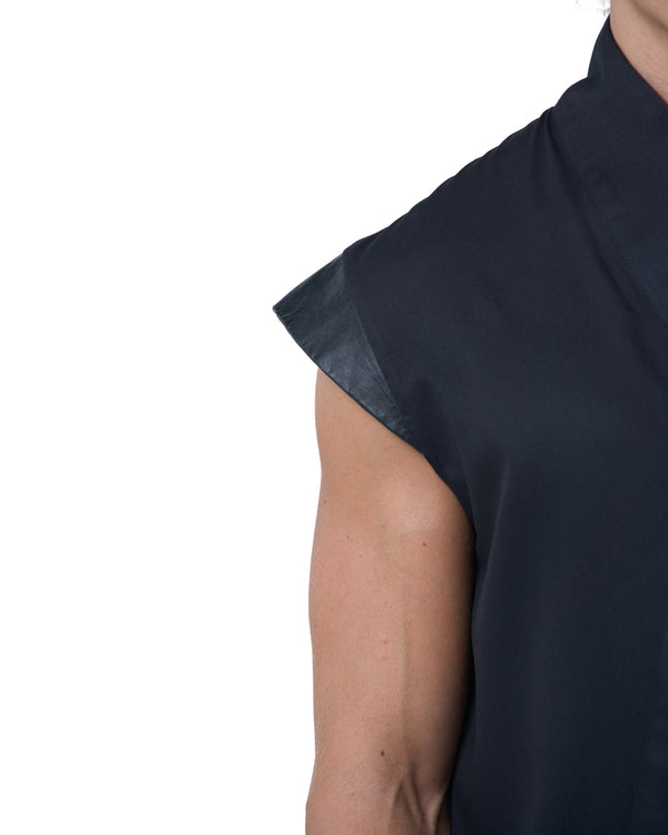 Black asymmetric jumpsuit with leather shoulders and diagonal zip closure by OVERZ