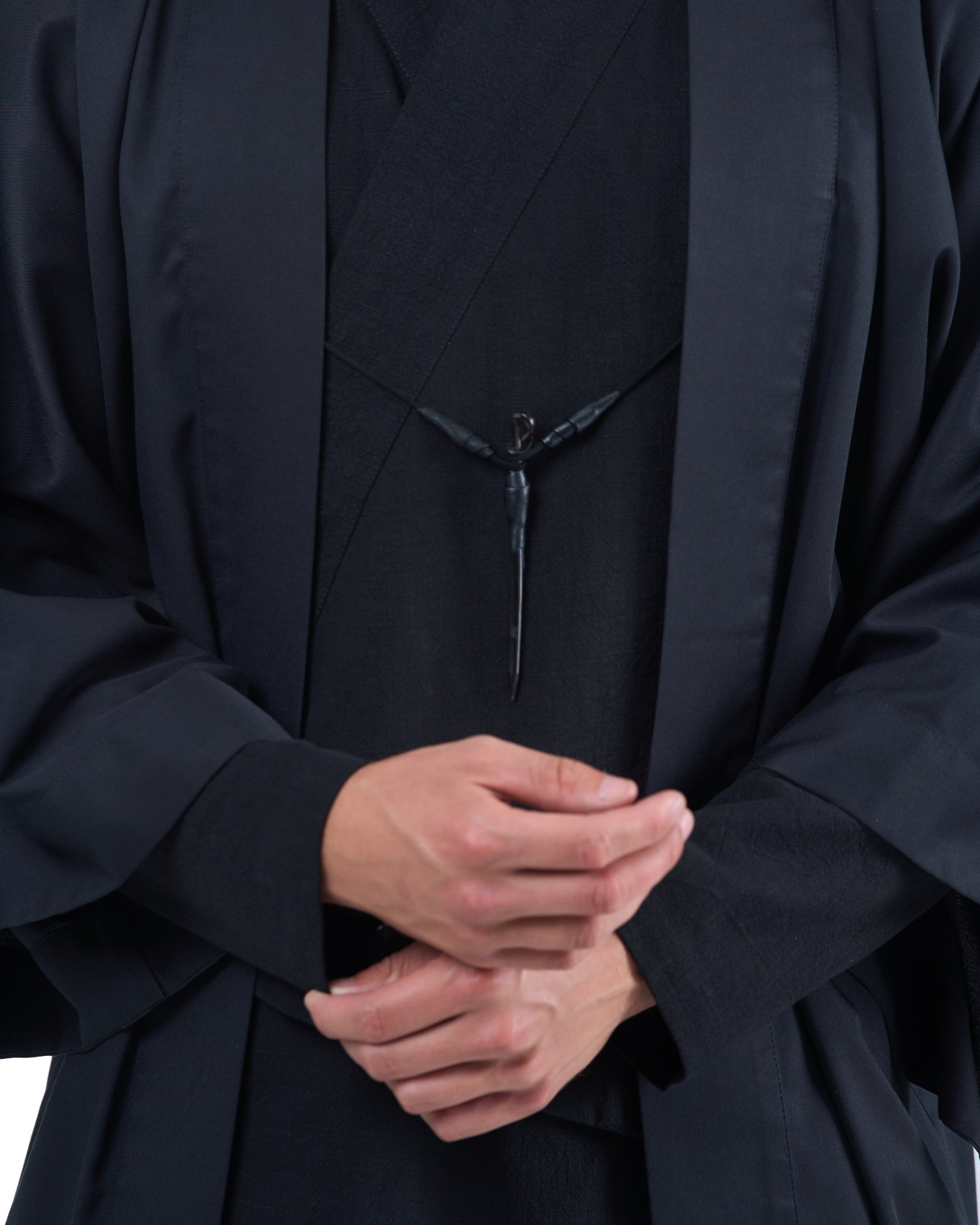 Black straight kimono jacket with leather haori himo and bison horn closure by OVERZ