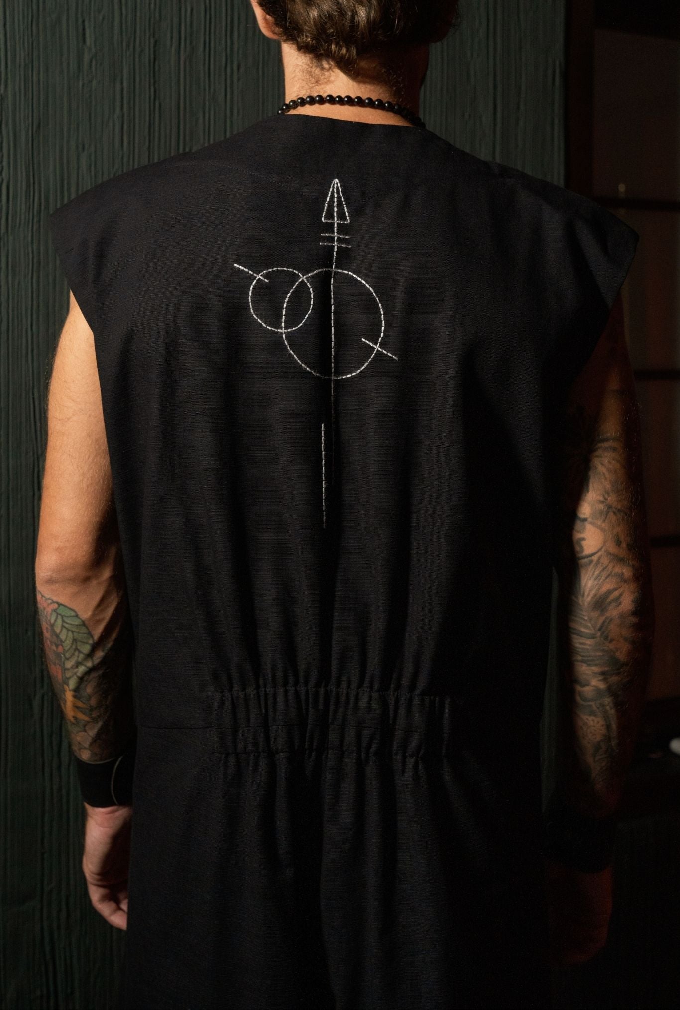 Minimalist black mens jumpsuit full body look, modern designer outfit Bali Ubud