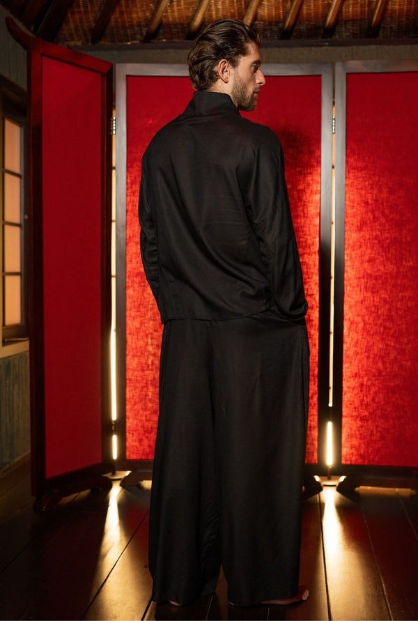 Minimal black men’s top styled with joggers, breathable fabric, tailored fit, designer menswear brand OVERZ